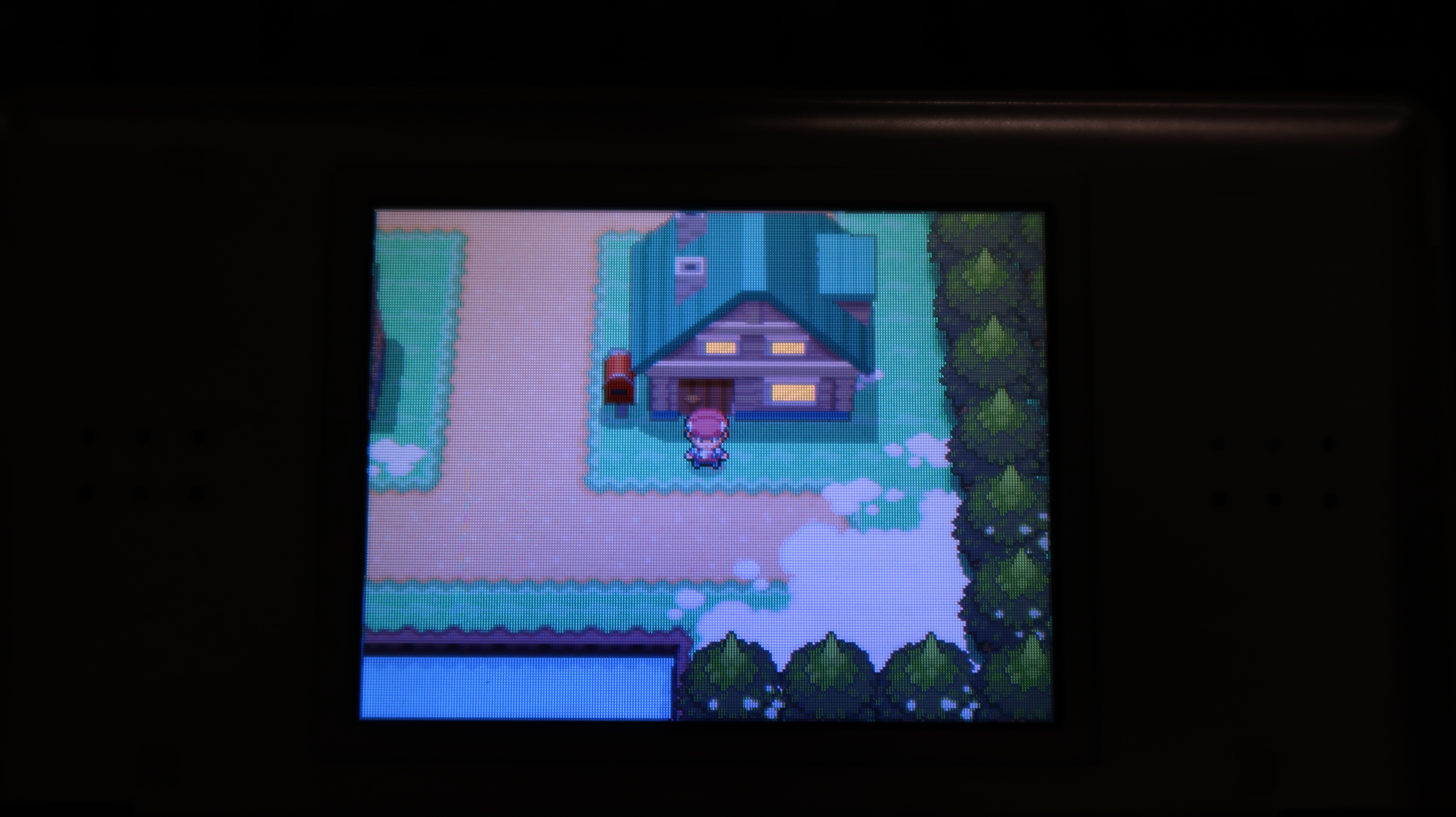 The main character sprite infront of his home